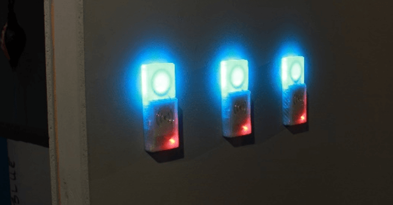 Three turquoise glowing RFID readers